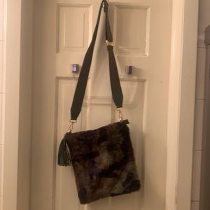 Women’s new ahdorned green and black camo faux fur cross body bag.